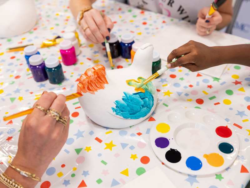 Children's of Mississippi patients and members of the PGA TOUR Wives Association painted chicken tee markers for the Sanderson Farms Championship. Jay Ferchaud/ UMMC Communications